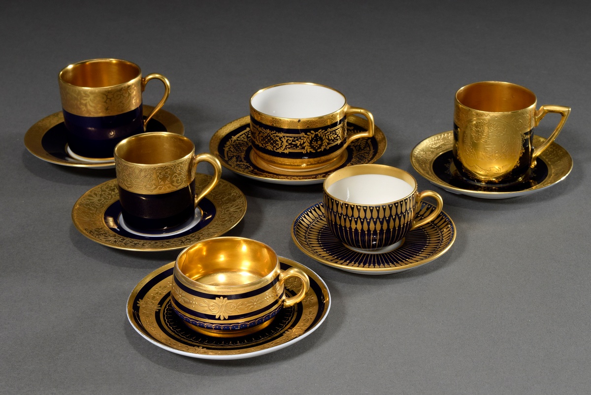 6 Various moch cups/saucers with different ornamental relief gold decorations on a cobalt blue back - Image 2 of 3