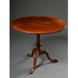 Round mahogany tea table on centre column over tripod with padfeet, England 19th century, folding t