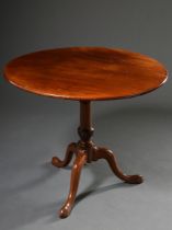 Round mahogany tea table on centre column over tripod with padfeet, England 19th century, folding t