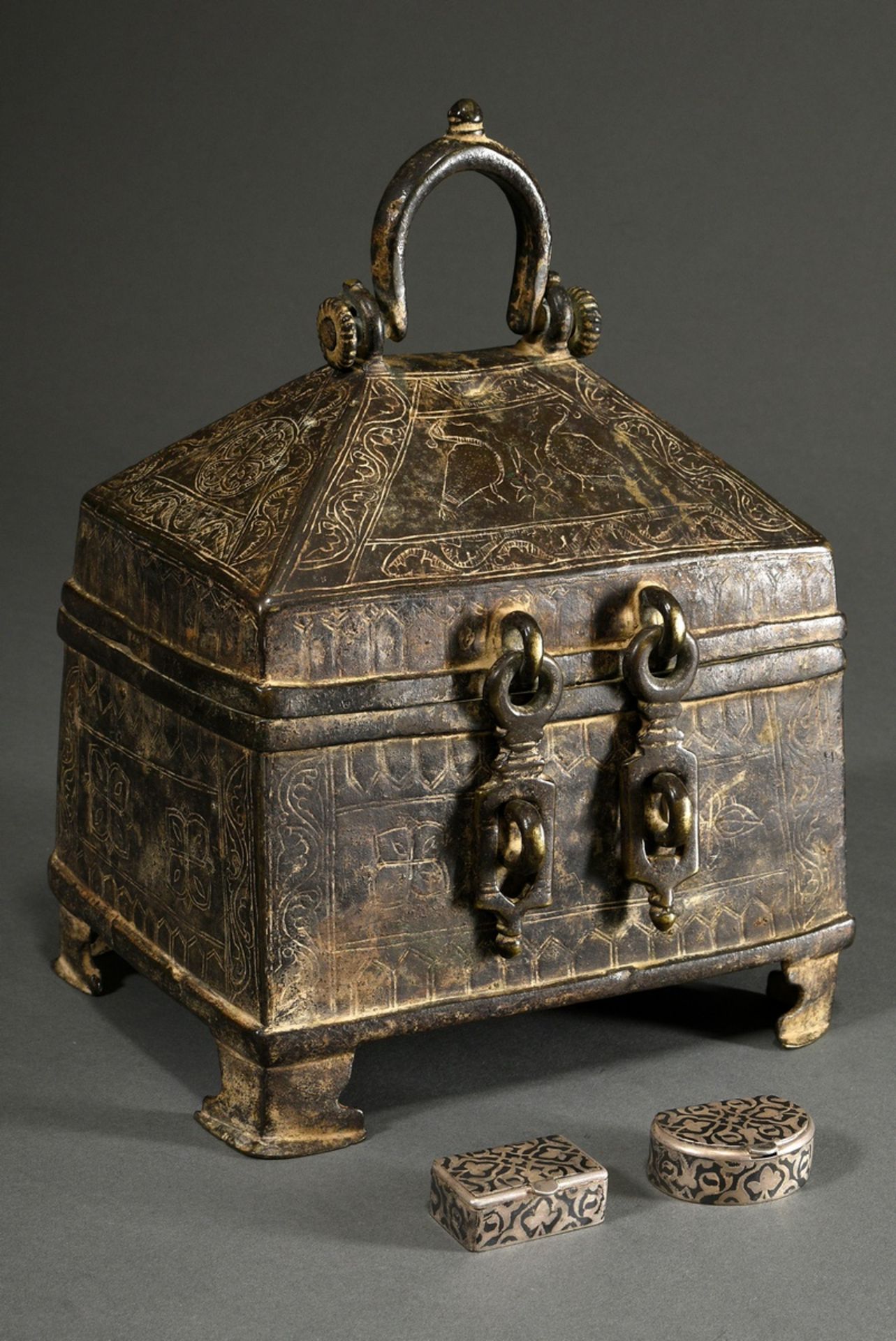 Indo-Persian bronze casket with rectangular body and roof-shaped lid and engravings "tendrils and b