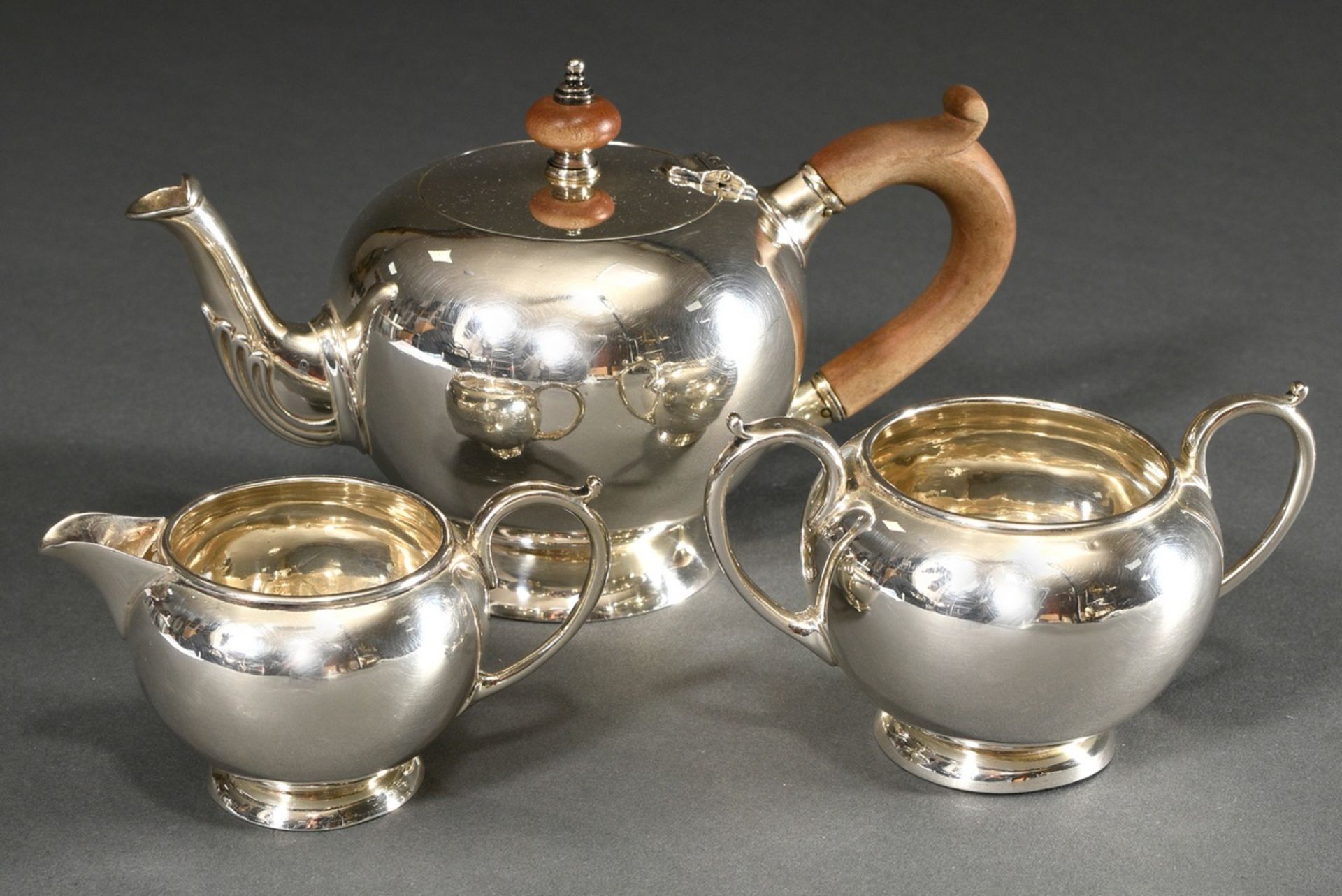 3 Pieces English tea set in George II form: teapot with wooden handle and two parts sugar and cream