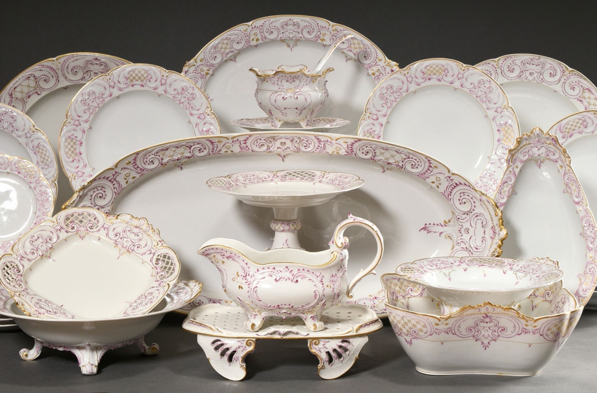 69 Pieces KPM dinner service in Rococo form with purple and gold staffage, red imperial orb mark, c