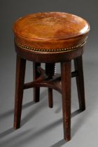 English mahogany swivel stool with brown leather upholstery, 19th century, h. 48.5cm, Ø 33cm, signs