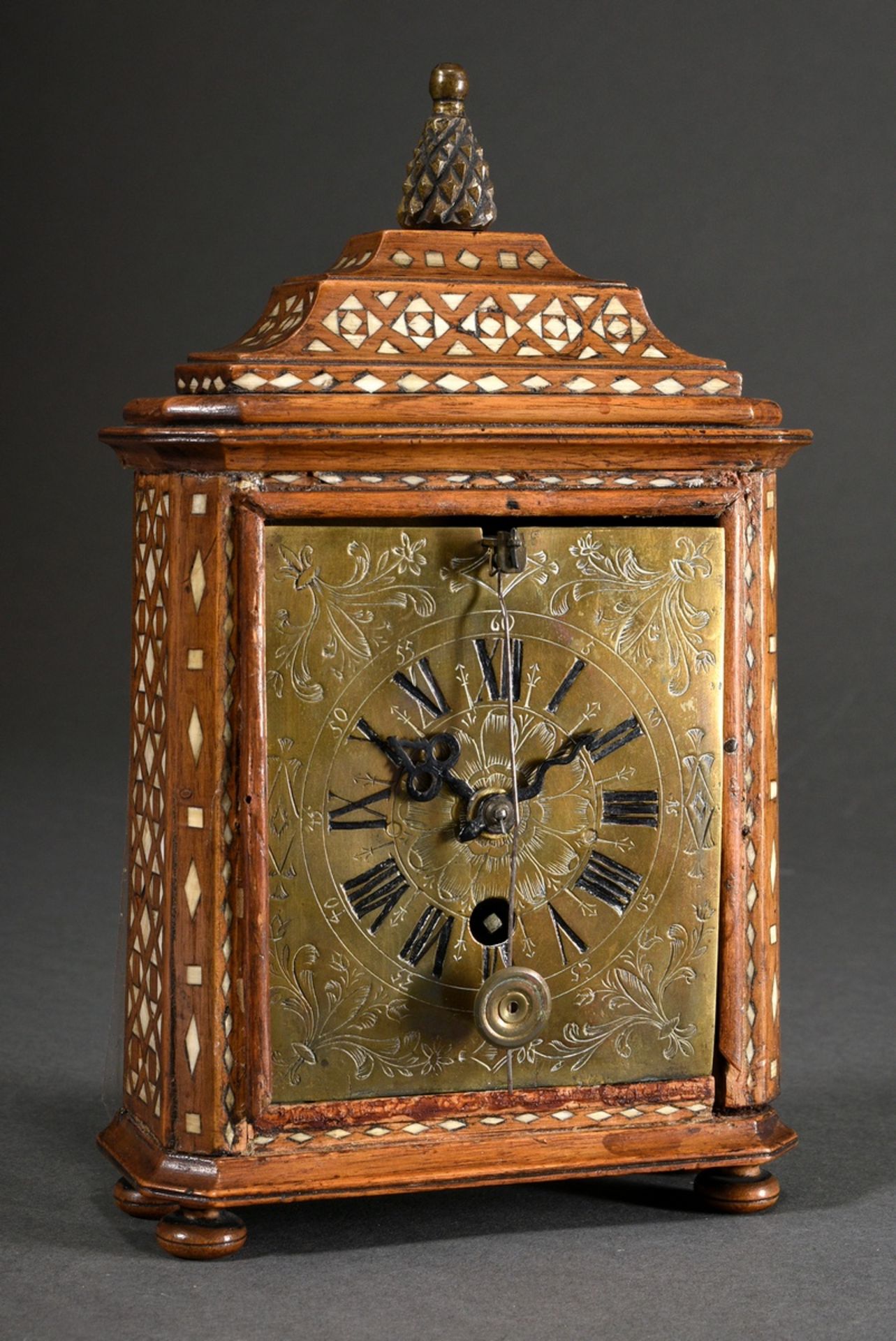 Small Vorderzappler clock in fruitwood case with geometric bone inlays and pineapple crown, florall