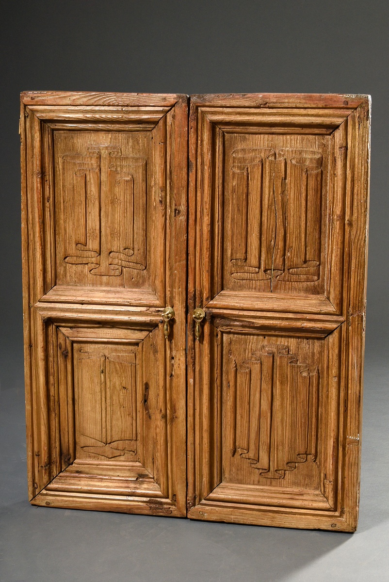 2 oak doors with folded panels, relief carvings in Gothic style in the infills, softwood, brass dro