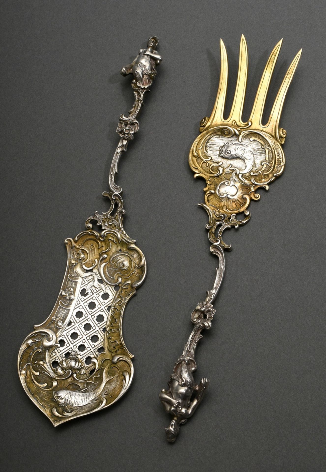 2 Pieces opulent Neo-Rococo fish serving cutlery with sculptural figurative handles and fish relief
