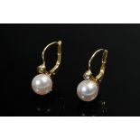 Pair of yellow gold 585 earrings with cultured pearls (Ø 6.7mm) and white imitation stones,1.9g, l.