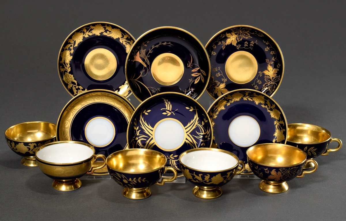 6 Various moch cups/saucers with different floral gold decorations "tendrils" on a cobalt blue back