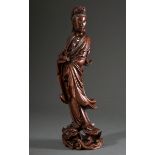 Guanyin standing on lotus leaf and dragon head in elegant movement, redwood with inset glass eyes, 