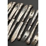 12 Pieces fish cutlery set with ornamentally engraved blades and spoons in the Kings pattern with m