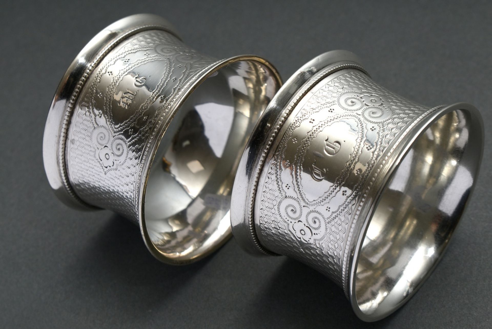 2 Guilloché napkin rings with Fraktur script monograms ‘CG/MG’, German, late 19th century, silver 1 - Image 4 of 4