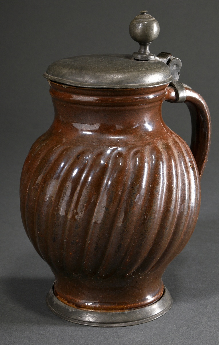 Bunzlau pear jug with diagonally drawn ribs and pewter foot ring and lid, 18th century, brown glaze