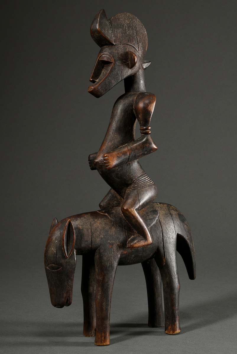 Equestrian figure in Senufo style, West Africa/ Ivory Coast, 2nd half 20th c., h. 44cm, signs of ag