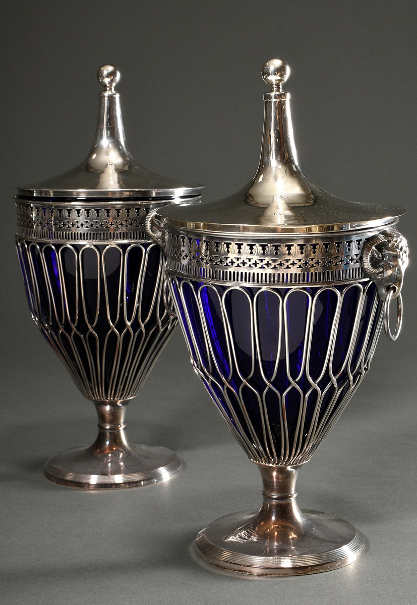 A pair of large silver-plated lidded vases with lattice bodies and sculptural trestle heads and blu