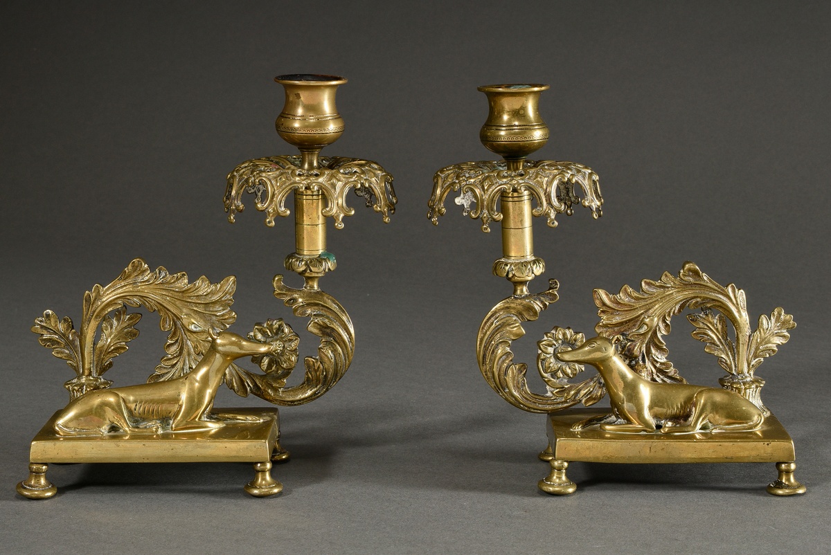 Pair of historicism yellow cast iron candlesticks with sculptural figures ‘Lying greyhounds’ and ve