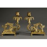 Pair of historicism yellow cast iron candlesticks with sculptural figures ‘Lying greyhounds’ and ve