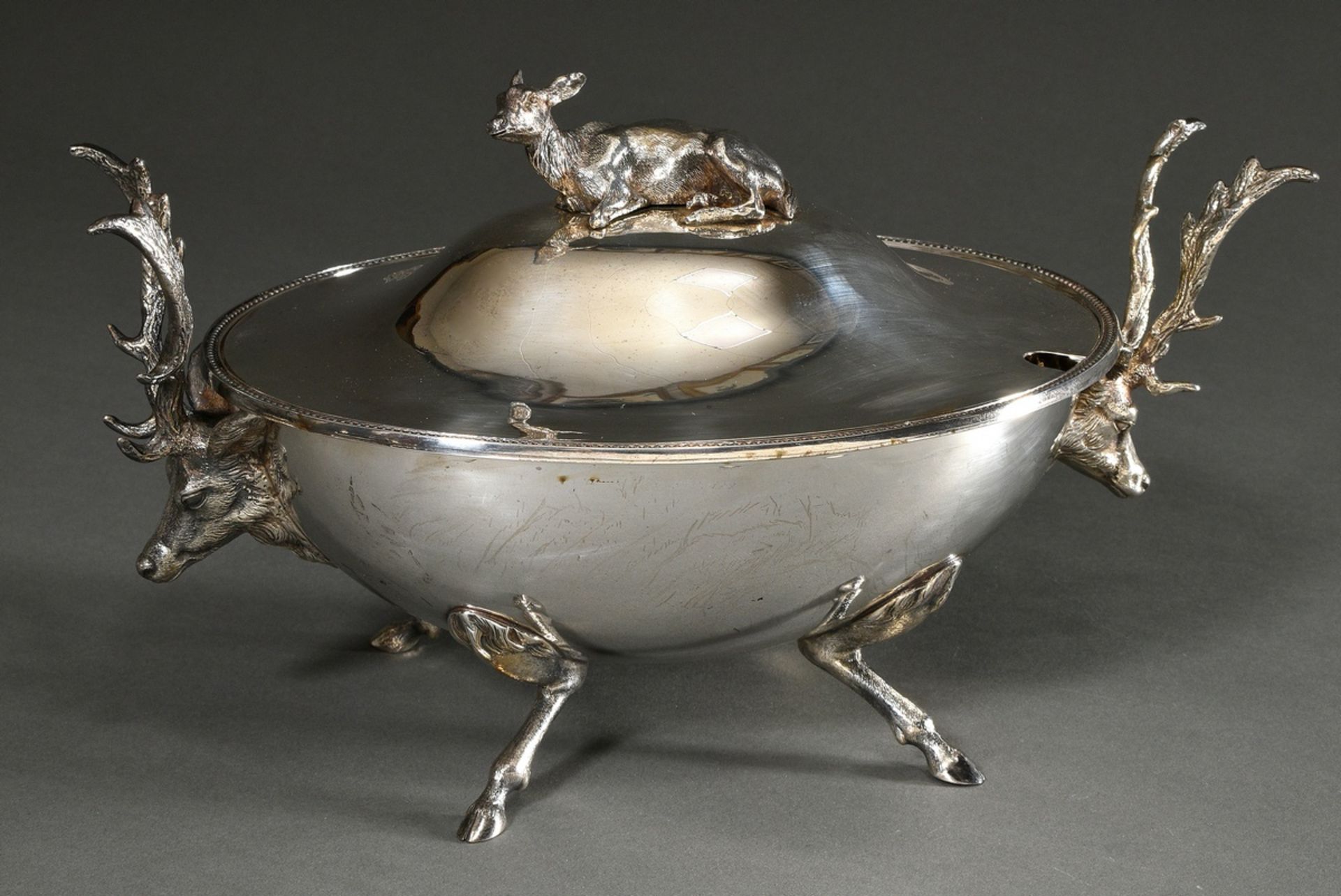 Decorative hunting lidded tureen with ovoid body on naturalistic cloven-hoofed feet and stag head h