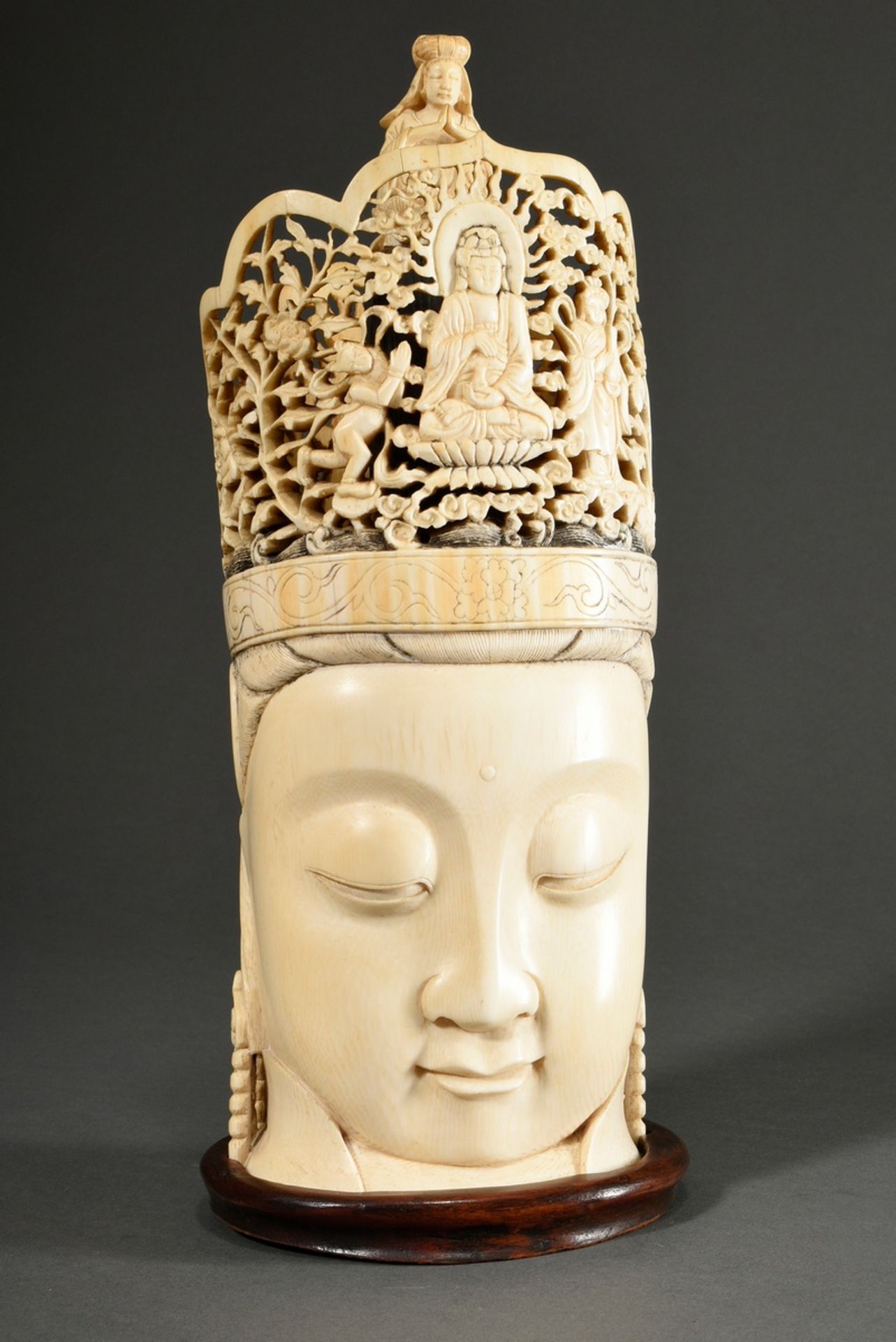 Large ivory carving ‘Head of Guanyin’ with openwork crown and depiction of Buddha with two adorants