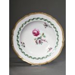 KPM soup plate with flower painting in purple, green and gray in the mirror as well as green band o