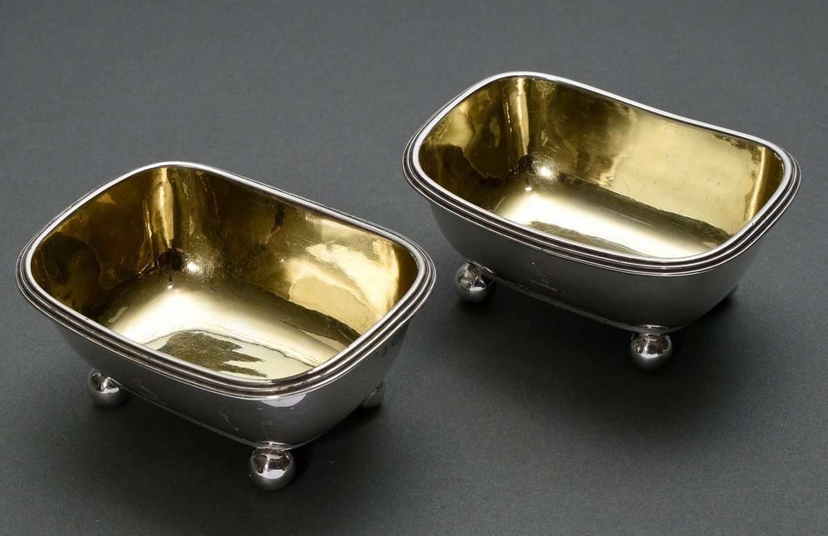 Pair of English salvers with moulded rim on feet and engraved ‘Arm with sword’, MM: Rebecca Emes & 