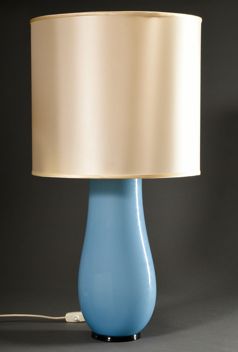 Venini table lamp with ovoid glass base in light blue opaque glass on black stand ring, old glue on