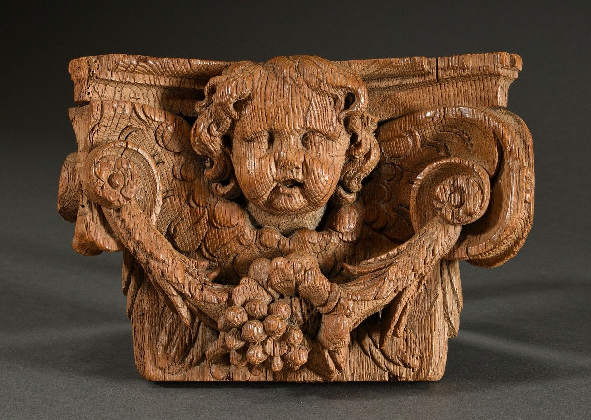 Baroque oak capital with cherub head and fruit and flower garland, 22.5x15x6.5cm, old wormholes