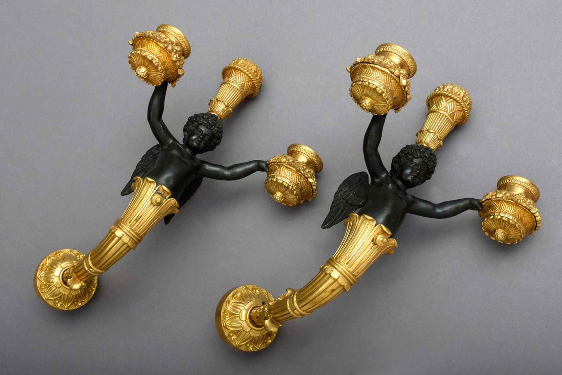 Pair of fine figurative Empire wall arms, cupids with flower baskets looking out of cornucopias, fi