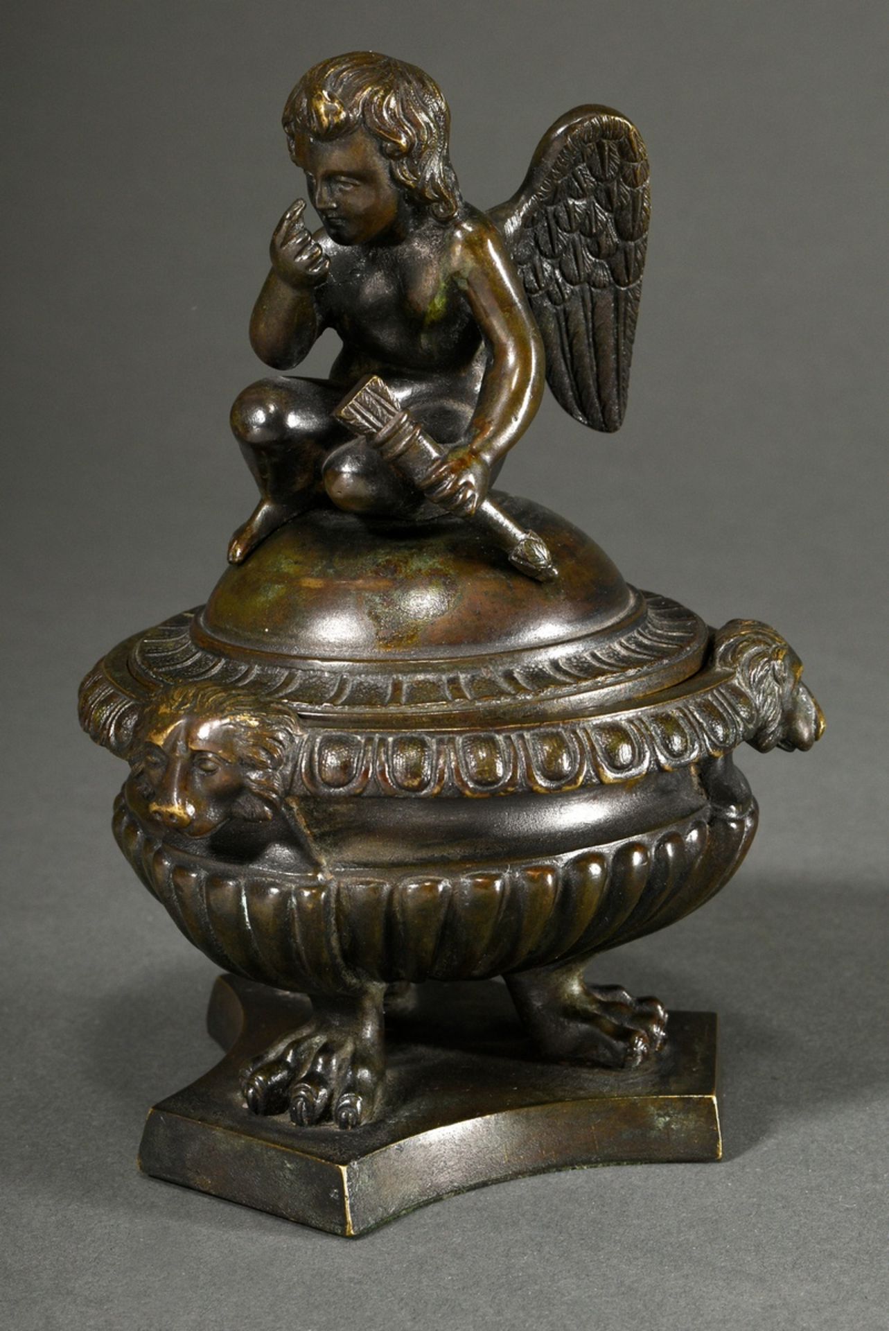 Bronze inkwell after a Renaissance model, fluted bowl with dog heads and lid with sculptural armour