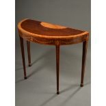 Elegant console table in semi-circular form on pointed legs with floral inlaid frame and fan motif 