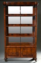 Biedermeier display cabinet with four shelves in front of a mirrored back wall, austere body with d