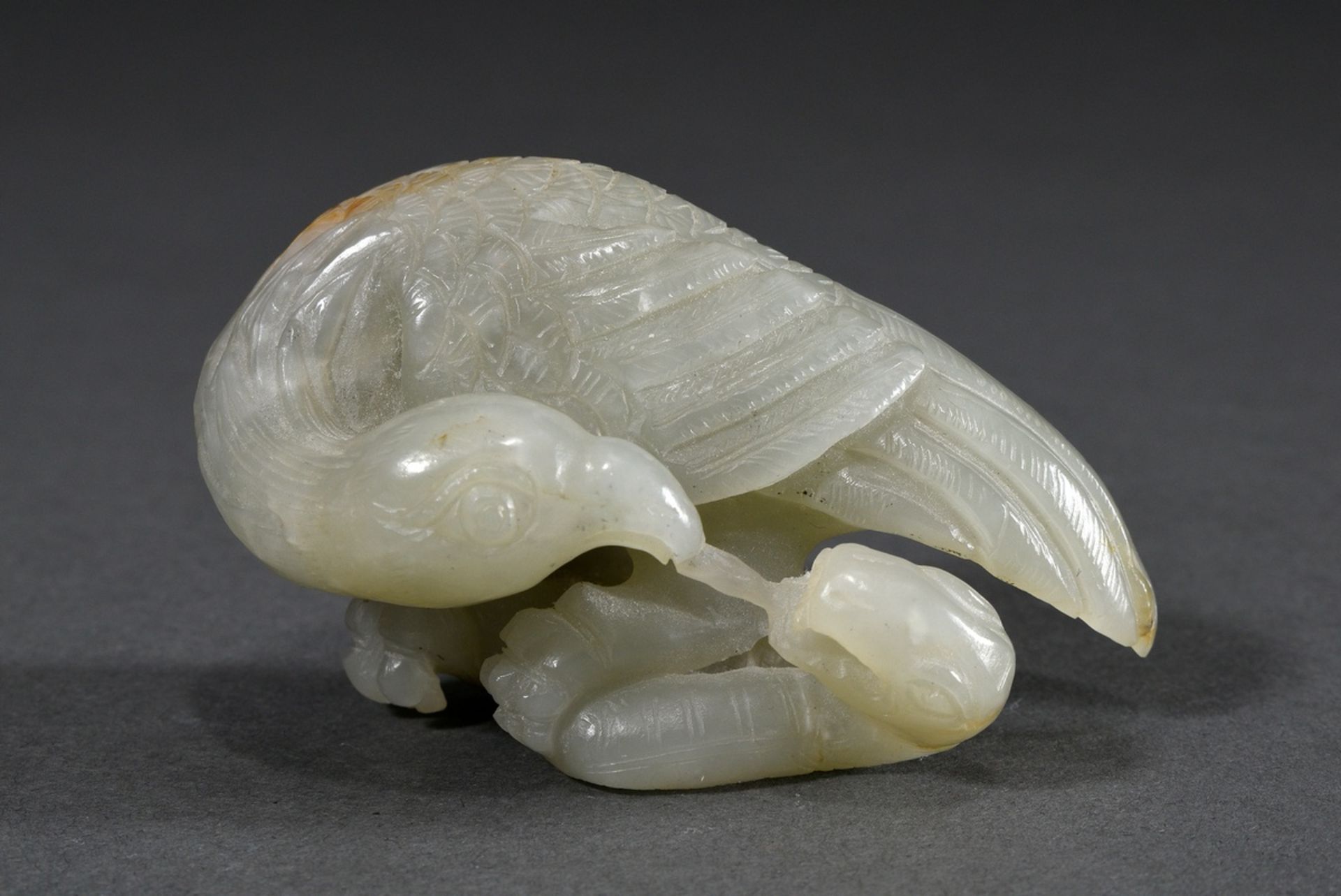 Finely carved celadon jade figure "Eagle and Snake" with rust colour, China Qianlong or later, l. 7