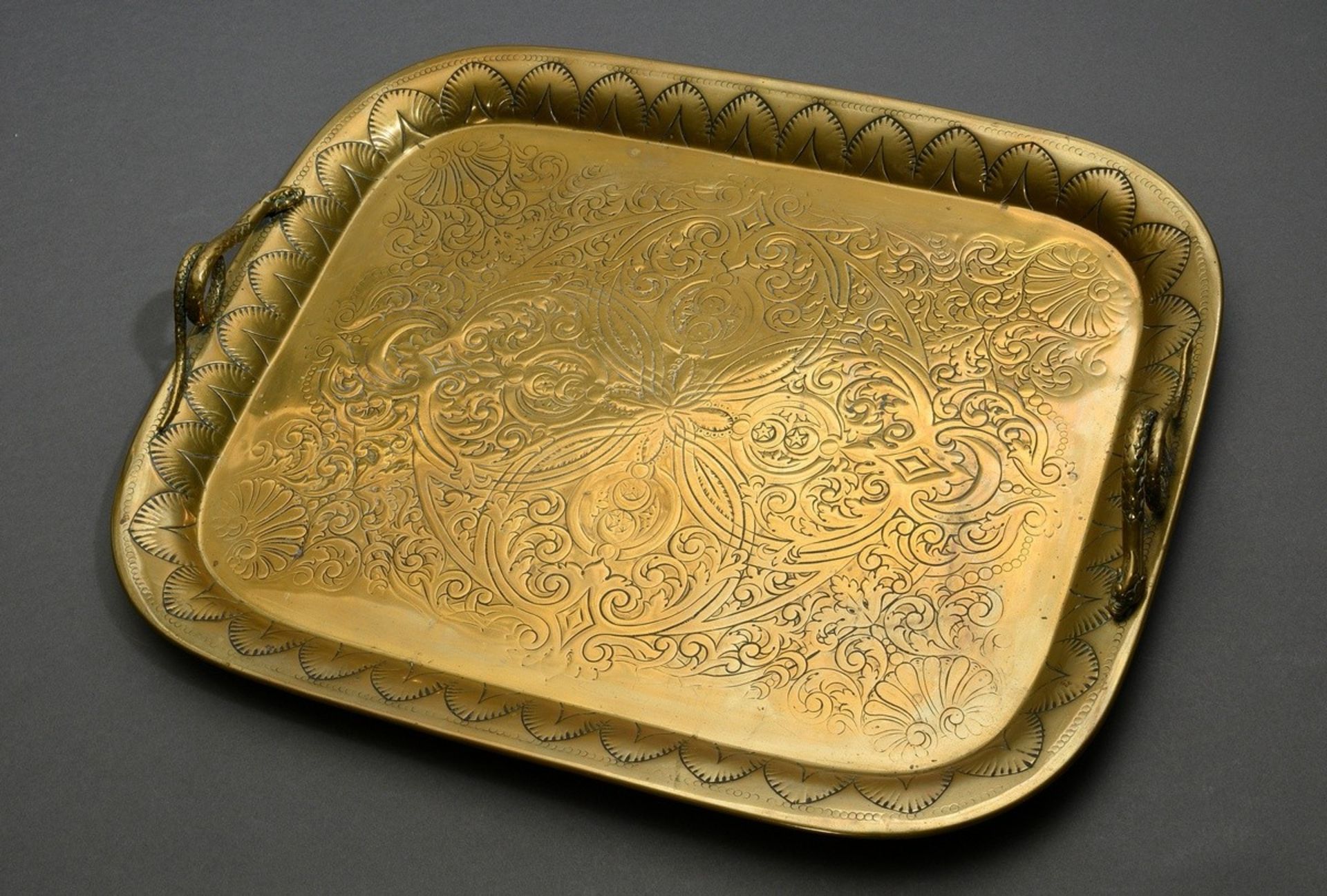 Rectangular brass tray with floral engraving and sculpted snake handles, 19th century, 56x45cm