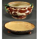 Rural ceramic bowl with polychrome glaze painting ‘Wolf and Hare’, sculpted foliate handles and inc