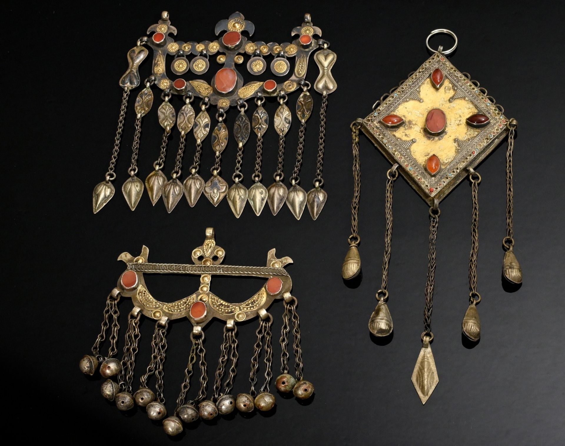 3 Yomud Turkmen amulets with bell pendants: 2 boys' amulets for hunting "Ok Yay" and a trapezoid pe