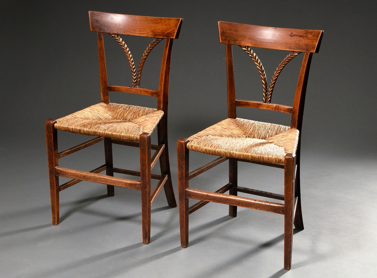 Pair of French farmhouse chairs with original wicker seats and carved ears of corn in the backrest,