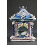 Faience pocket watch holder in the shape of a house with a tent roof, sculptural angel heads, scrol