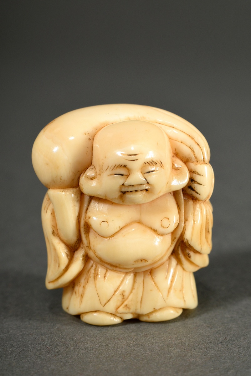 Netsuke ‘Hotei with sack on shoulder’, whale tooth hollowed out inside, 1 Himotoshi, early 20th c.,