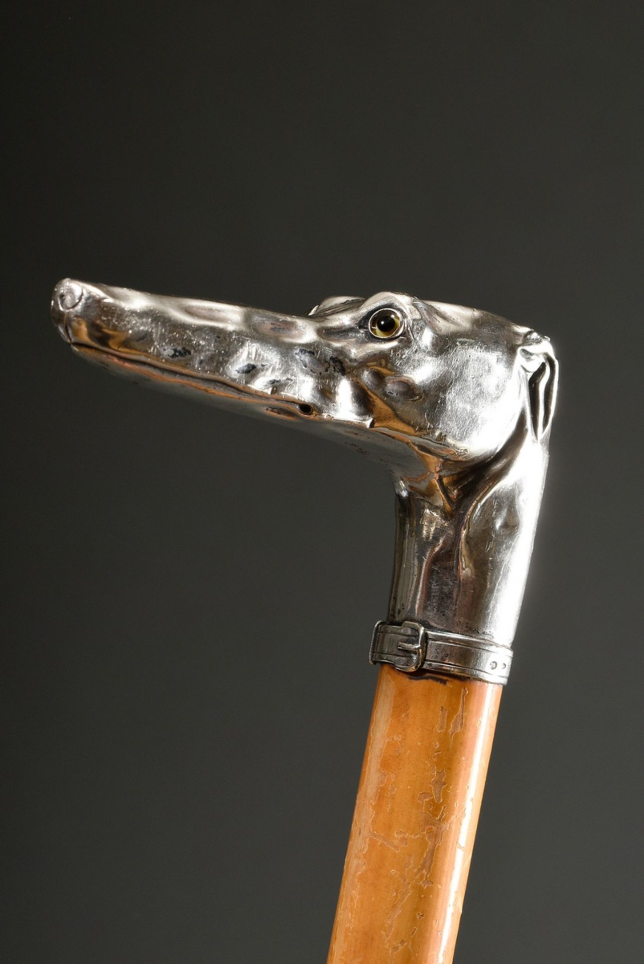Walking stick with sculptural crutch ‘greyhound head’, silver with glass eyes, palm cane weft, appr