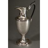 A classic silver-plated tankard on a high foot with a black wooden handle, England 1st half 19th ce