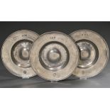 3 pewter wide rim plates with a humped centre, each dated and marked on the rim "A.R.D. Anthon Melc