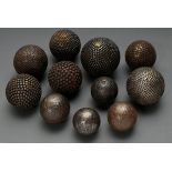 11 Various boules and petanque balls in different sizes with decorative fittings made of iron and b