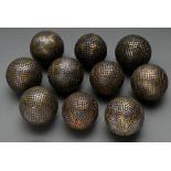 10 Various boulle and petanque balls with decorative iron, brass and copper nails ‘letters and symb