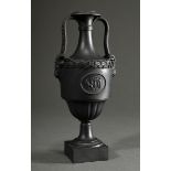 Antique Wedgwood black basalt ware amphora on a square foot, baluster body with laurel rim and scul