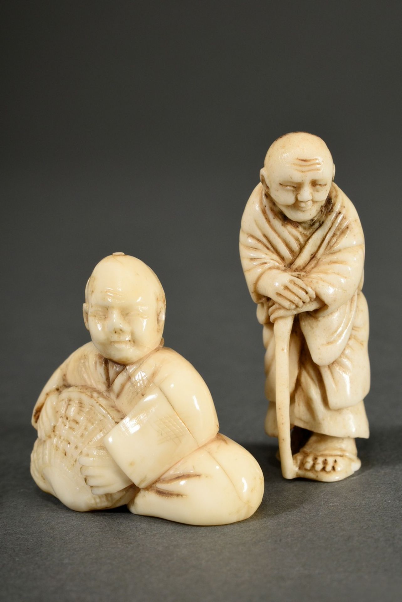 2 Various animal tooth netsuke: ‘Blind man with stick’ (h. 4.8cm) and ‘Sitting man with clam’ (h. 3