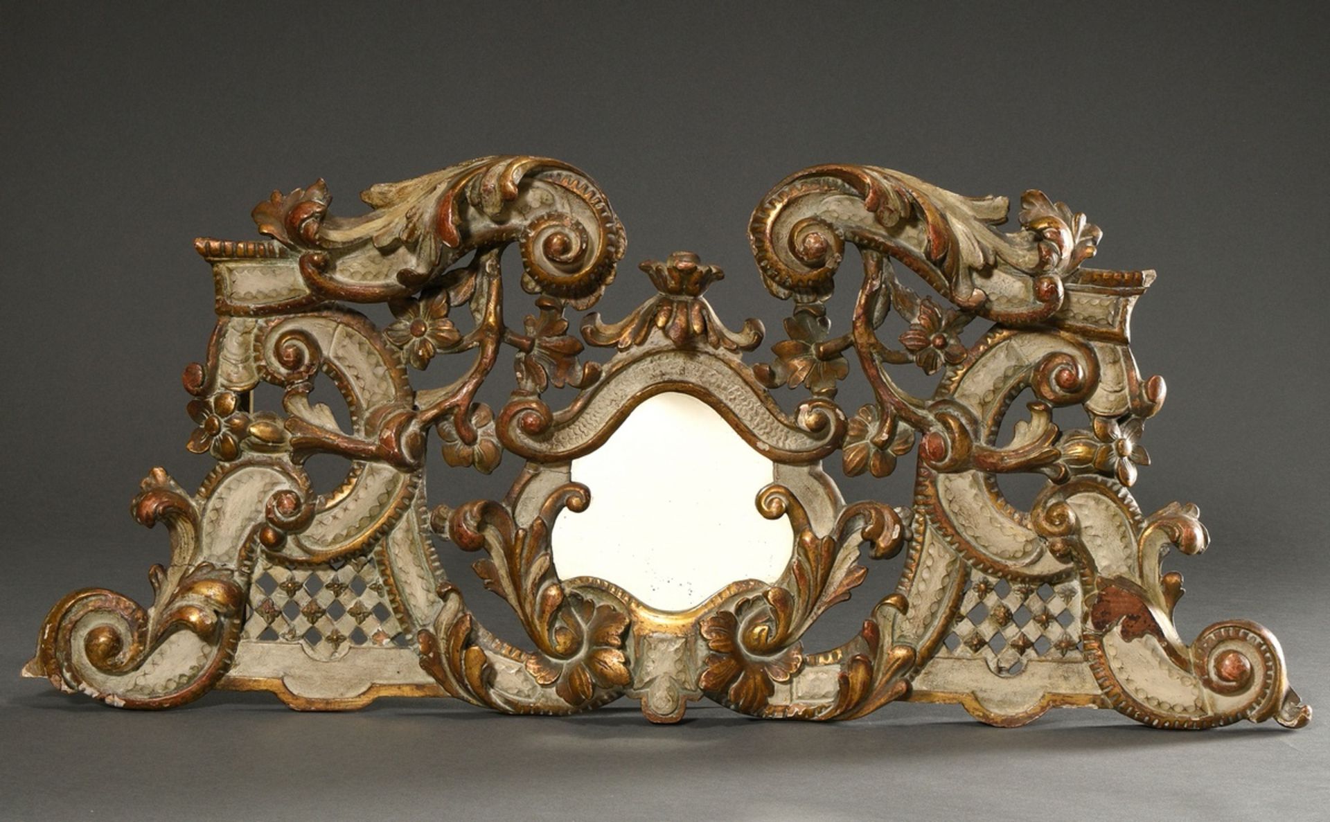 Elaborately carved and finely pierced supraport with volutes, garlands of flowers, latticework and 
