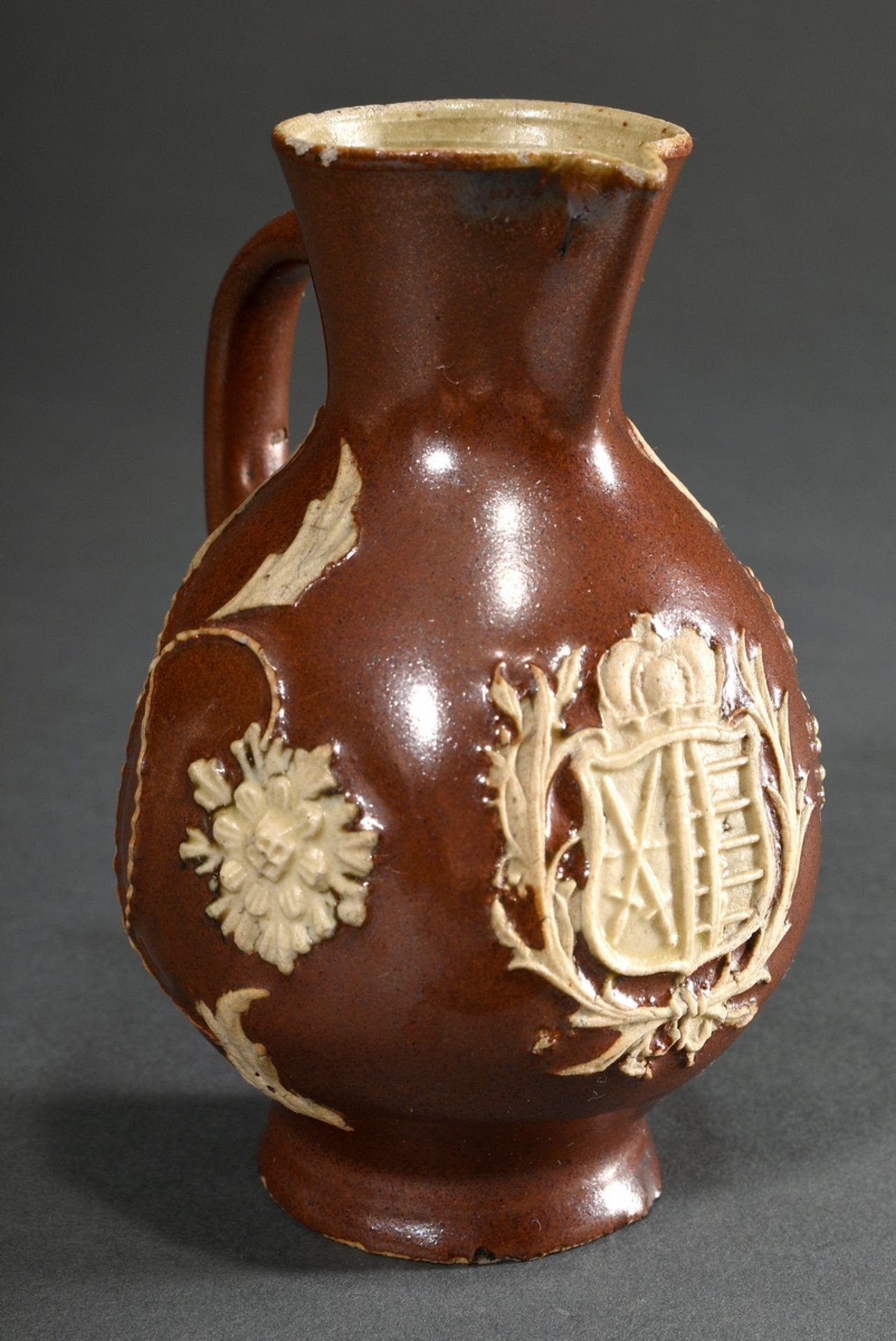 A small Bunzlau jug with Saxon coat of arms, globular form over a slightly flared foot, short funne