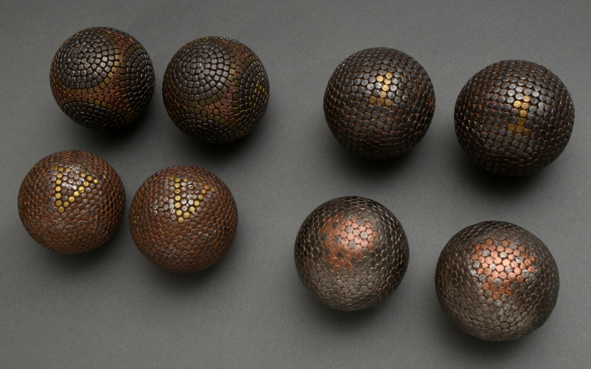 4 various pairs of Boulle balls with decorative iron, brass and copper nails, France around 1900, Ø
