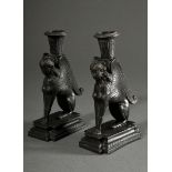 Pair of iron ‘Spinx’ candlesticks in classicist façon on angular pedestals, 2nd half 19th century, 