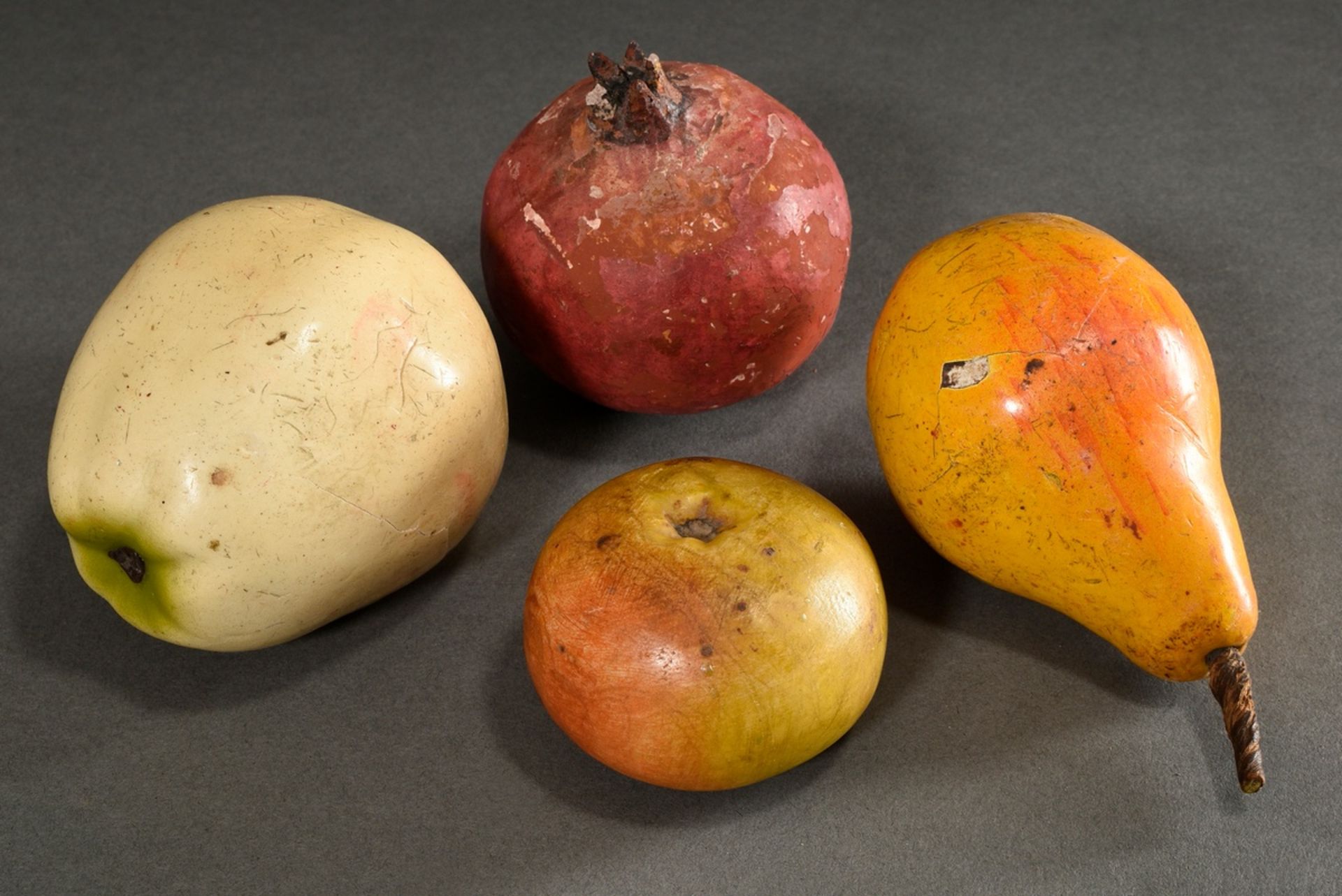 4 Various pieces of naturalistic decorative fruit made of different materials (alabaster, wax, cera