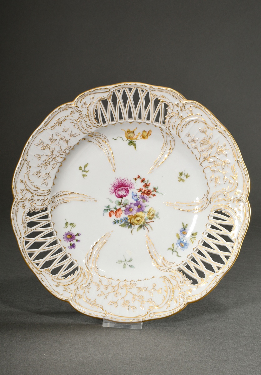 KPM plate with polychrome house painting "Flowers" and rich gold staffage on a six-lobed rim and ri